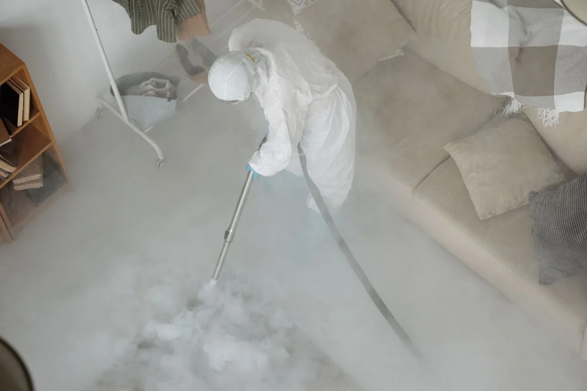 Biohazard cleanup technician in protective equipment, Rolling Green, Milwaukee, WI